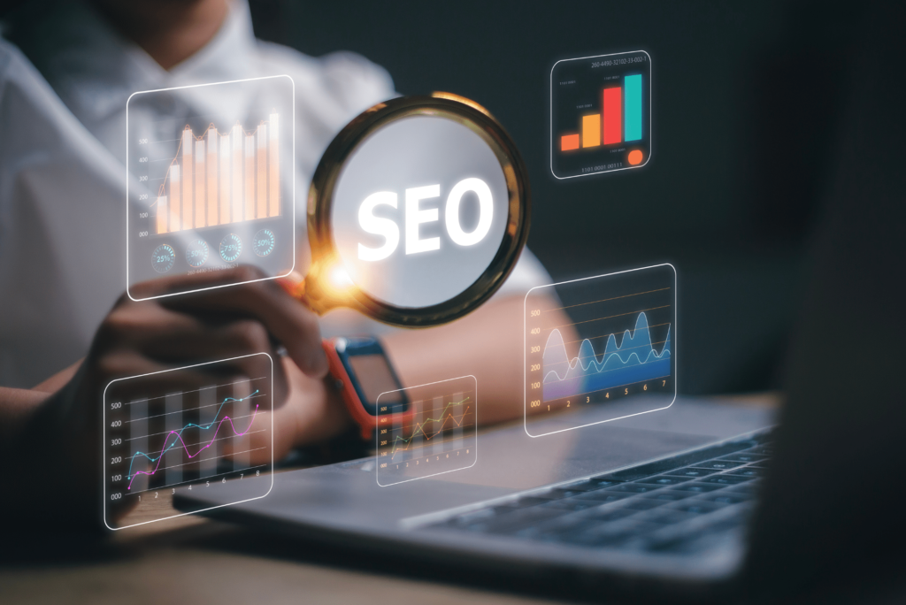 photo of man working on laptop holding a magnifying glass on seo for consulting firms
