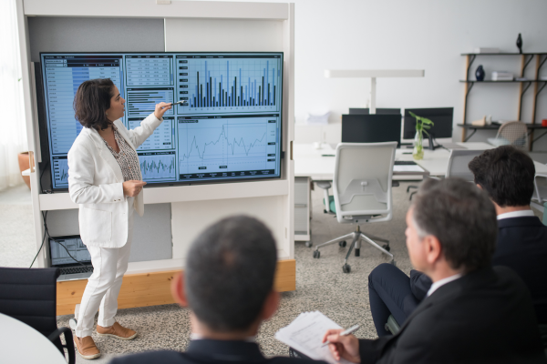 Business team reviewing analytics dashboard showing digital marketing trends 2025